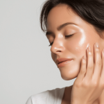 Woman with glowing, hydrated skin after a luxury facial treatment, representing autumn and winter skincare results at a holistic beauty salon.
